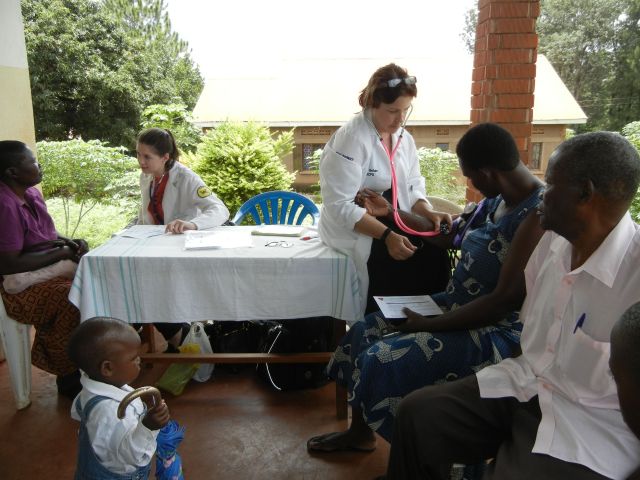Stacy and Dr. Bohan take Blood Pressures at All Saints Cathedral, Church of Uganda