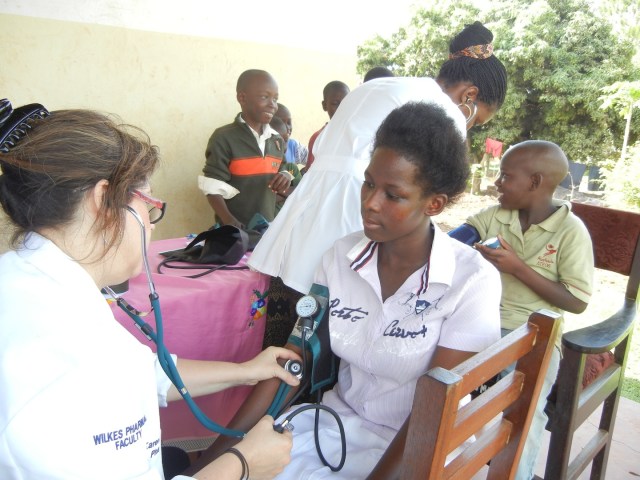 KarenBeth taking a patient's Blood Pressure