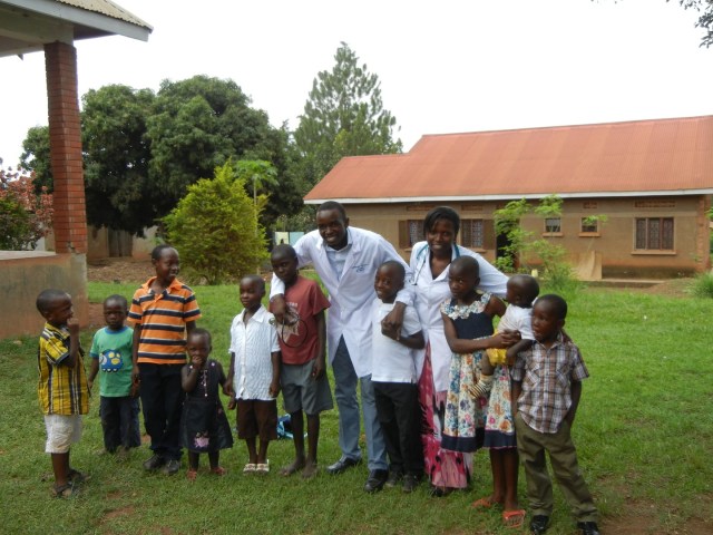 Sam and Linda play around with the kids who hung out all morning and avidly watched us- who know, maybe they are future pharmacists