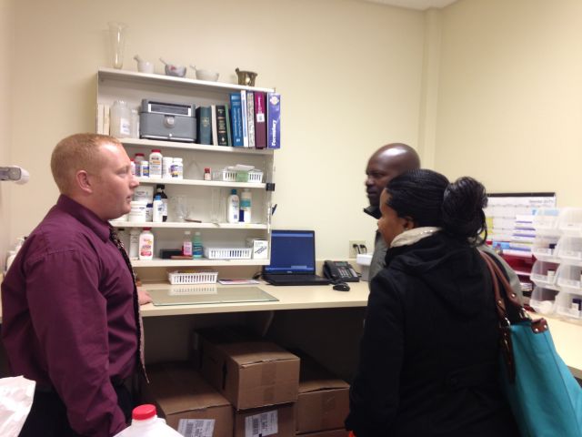 Rich explains some of the pharmacy procedures to Patrick and Vicky on Day 1 of their experience in USA