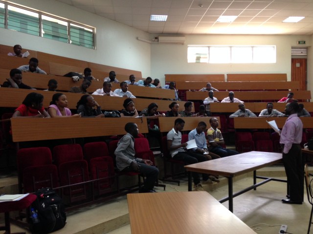 4th Year Pharmacy Students gather to find out what topics they have to study for this week's Problem-Based Learning (PBL) tutorial; Mr. Kalidi Rajab, BPharm, MPS is speaking