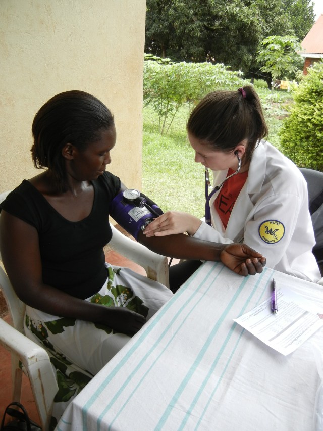 Stacy participating in a Blood Pressure screening event in Masindi, Uganda fall 2013