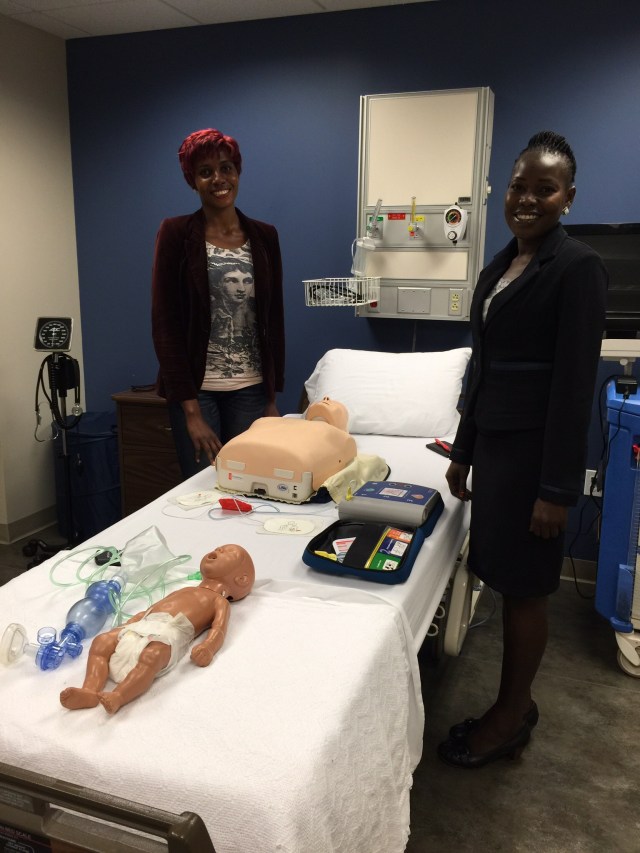 Cathy and Gonsha prepare to take the CPR practical exam 