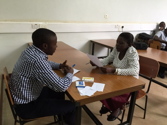4th year students demonstrating their pharmacist-patient interaction in front of the class