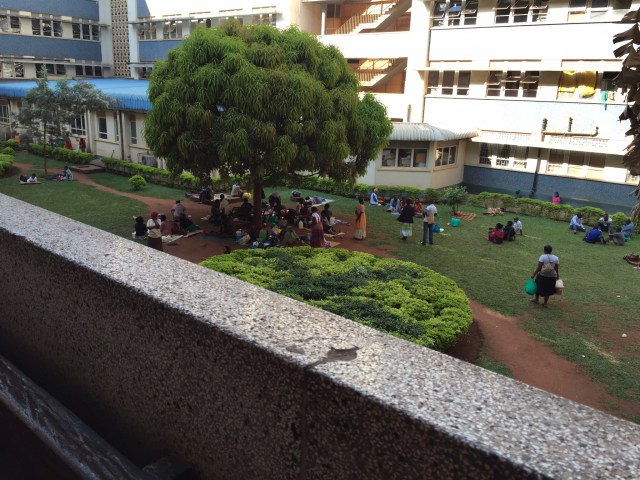 This is an image of the courtyard in one part of the extremely large Mulago Hospital. You can see how the caregivers gather here to dry laundry and cook food.