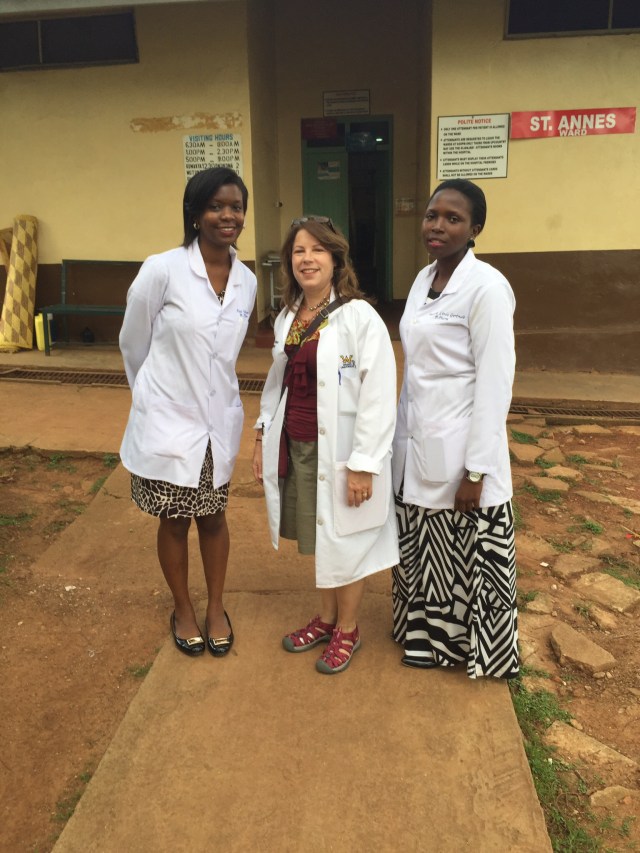 Edel, KarenBeth, and Linda- some of my past Ugandan Students. We are standing outside of the women's ward.