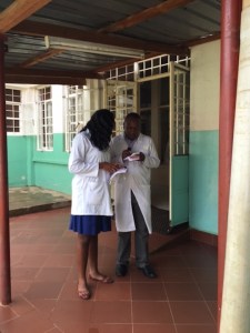 Wendy and Robin look up drug information in his smart phone. One of the things I've been working with the Pharmacy students and Interns on is the use of point-of-care medical apps on their phones (most do have smart phones now days)